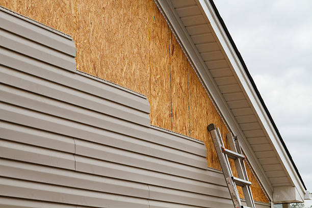 Professional Storm Damage Siding Repair technician working in Akron, PA